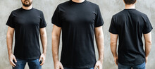 Young Man With A Beard In An Empty Black Casual T-shirt. Front, Close-up And Rear View On A Light Gray Concrete Wall. Design And Layout Of Men's T-shirt For Printing.