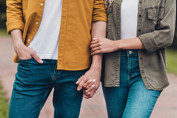 Canvas Print - Cropped view of attractive careful couple life partners meeting on fresh air spending spare free time outdoors