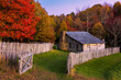 Sunset glow on historic cabin and autumn foliage at the Cumberland Gap National Park