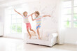 © famveldman - Kids play at home. Children jump, run and dance
