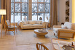 © 4595886 - cozy warm home interior of a chic country chalet with a huge panoramic window overlooking the winter forest. open plan, wood decoration, warm colors and a family hearth