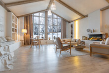 Cozy Warm Home Interior Of A Chic Country Chalet With A Huge Panoramic Window Overlooking The Winter Forest. Open Plan, Wood Decoration, Warm Colors And A Family Hearth