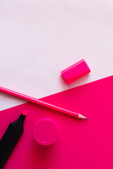 Wall Mural - top view of marker pen and pencil near jar with paint on textured white and pink.