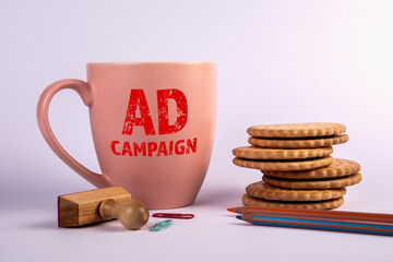 Wall Mural - Ad Campaign. Coffee mug with text and office supplies on a white background