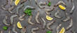 Flat lay raw tiger prawns with lemon and parsley on a dark rustic background. Fresh shrimp pattern. Top view, banner.