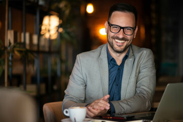 Wall Mural - Portrait of a young caffe manager, smiling and looking on camera