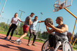 © BalanceFormCreative - A physically challenged person play street basketball with his friends.