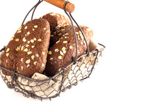 Dark Brown Bread With Oats On A White Background