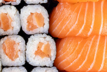 Salmon Sishi And Maki Roll Close Up. Fresh Japanese Cuisine