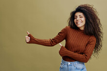 I LIKE IT CONCEPT. Overjoyed Awesome Curly Latin Female Smiling And Looking At The Camera, Gesturing Like, Saying Yeah. Copy Space For Accessories And Clothing Fashion Brands, Free Place For Your Ad