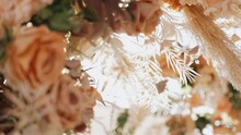 Bright Sunlight Breaks Through Branches Of Artificial Flowers That Sway In Wind. Flower Arrangement In Warm Sunny And Windy Weather. Sunny Bunnies. Blur Effect. Sun's Rays Illuminate Frame
