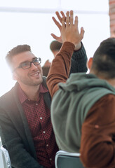 Poster - business colleagues giving each other high five