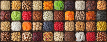 Colorful Dried Fruits, Assorted Nuts And Seeds Background. Mixed Raw Food For Snacking, Top View.