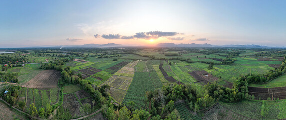 high aerial farmland view with sunset in evening time for create nature wallpaper