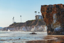Pismo Beach Cliffs At Sunset And Silhouette Of Hotels Overlooking The Water's Edge, California