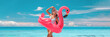 © Maridav - Beach vacation summer Caribbean travel woman sunbathing relaxing with swimming pool pink flamingo float - funny holiday banner panoramic