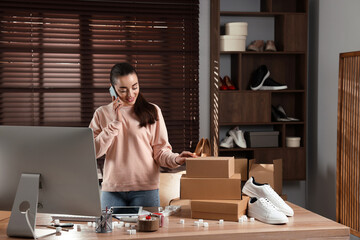 Poster - Shoes seller talking on phone in office. Online store