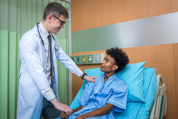 Doctor Visiting man Patient On Ward. Hospitalized man lying in bed while doctor checking his. physician examining male patient in hospital room.