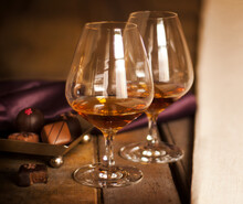 Cognac Glasses With Cognac And Holiday Chocolates 