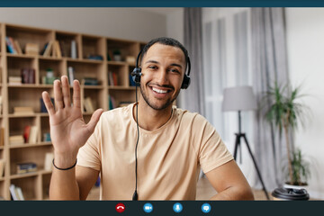 Poster - Videocall screenshot of cheerful arab man in headset having web conference, waving hand at camera and smiling