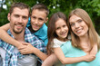 © aletia2011 - Portrait of happy young family in summer  park