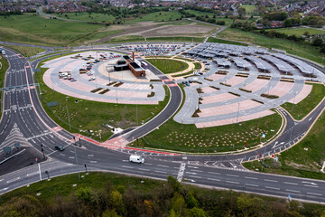 Wall Mural - Aerial view of an innovative Park and Ride location with innovative solar panels on air park rooftops