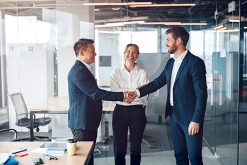 Wall Mural - happy leader shaking hand with businessman for congratulation success presentation new project.