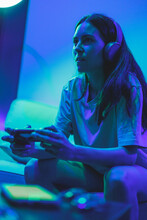 Involved Gamer Girl Playing Video Games On The Console On The Couch