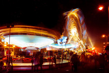 Illuminated Moving Rides At The St Giles Fair In Oxford At Night