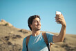 © olly - young man takes a selfie
