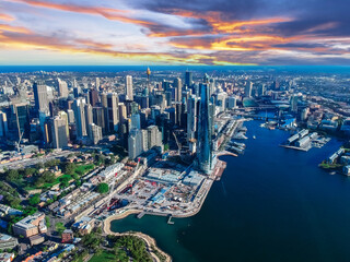 Wall Mural - Sydney Harbour Australia with nice colours in the sky. Nice blue water of the Harbour, high rise offices and residential buildings of the City in the background, NSW Australia