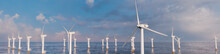 Wind Turbines. Offshore Wind Farm On A Cloudy Morning. Sustainable Power Concept.