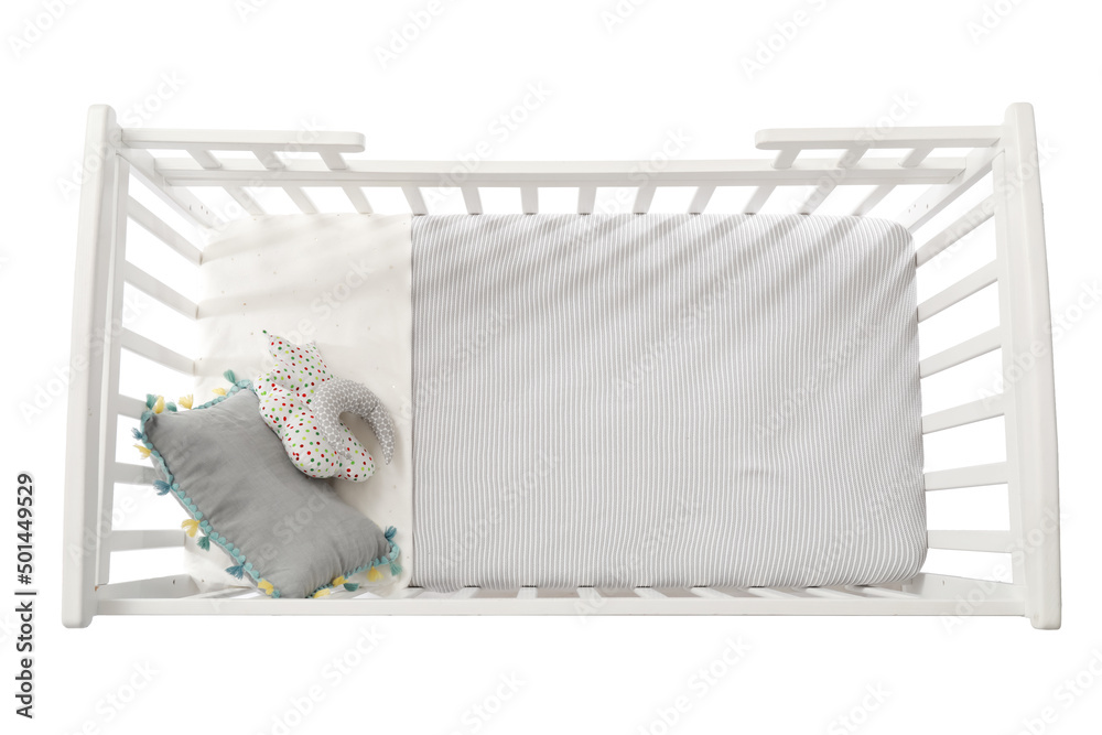 Stylish baby bed with cute pillows on white background