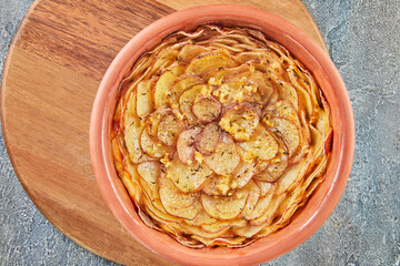 Canvas Print - Potato pie with garlic and thyme on wooden board