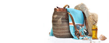 Beach Bag And Accessories   With Shells And Solar Oil On White Background