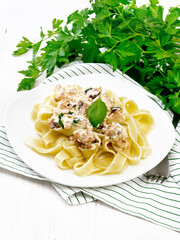 Sticker - Pasta with salmon in cream on light wooden board