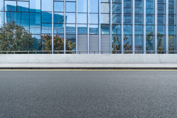 city empty traffic road with cityscape in background