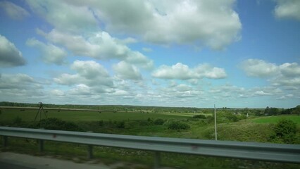 Wall Mural - Rural landscape in summer. Footage of a beautiful field and sky.