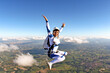 Beautiful woman skydiving in freefall, adventure freedom concept