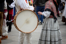 Man In Period Dress Holding A Drum With A Girl At The Popular Festival Of The Reconquest