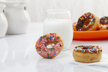 Closeup Of Donuts Near A Cup Of Milk