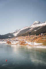 Sticker - Vertical shot of a lake in Breil or Brigels, a municipality in Surselva, Switzerland