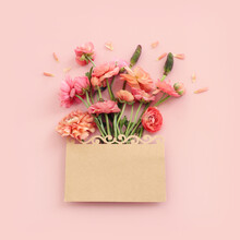 Top View Image Of Pink Flowers Composition And Empty Note Over Pastel Background