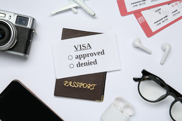 Sticker - Composition with passport, toy plane and tickets on white background, top view. Visa receiving