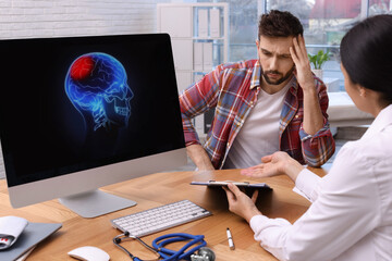 Poster - Young neurologist consulting patient at table in clinic