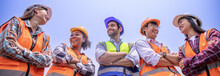 Group Engineers Stand Smiling Happily Working Safety First,wearing Hard Hats, Reflective Vests.Workers Various Nationalities, African,Middle Eastern, Western,Asian,Thai,working Together Banner Cover.