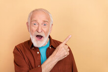 Photo Of Impressed Aged Grey Hairdo Man Index Promo Wear Brown Shirt Isolated On Beige Color Background