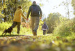 © avtk - family walking in the forest