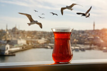 Traditional Turkish Cup Of Apple Tea On A Background Of Istanbul Cityscape.