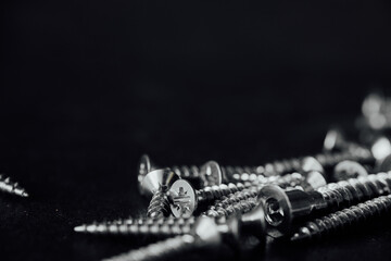 Wall Mural - Closeup shot of drywall screw double bugle heads on an isolated background